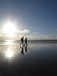 SX25548 Matt and Libby walking on beach.jpg